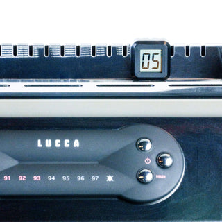 Shot timer accessory mounted on espresso machine group head with a digital display showing 05