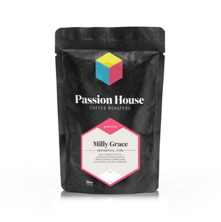 Milly Grace coffee bag showing a cream label framed in pink on a dark geometric bag
