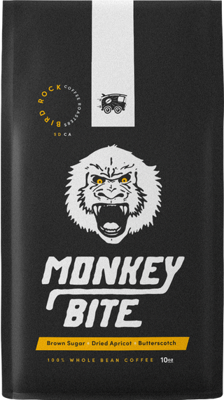 Monkey Bite coffee bag featuring a roaring white gorilla graphic and yellow accent label.