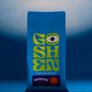 Moonstone coffee bag close up at the top with bright blue packaging and partial Goshen Roasters logo