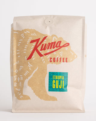 Side angle of Ethiopia Guji bag showing kraft packaging and teal Guji label near the bottom