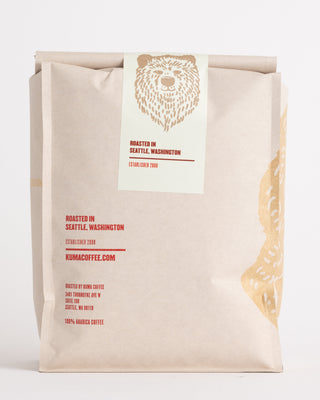 Kuma Coffee Ethiopia Guji bag featuring a large tan bear print and teal ETHIOPIA GUJI label