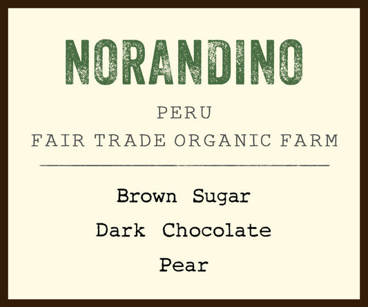 Norandino Peru Fair Trade Organic Farm coffee label on cream background with green NORANDINO text and brown border.