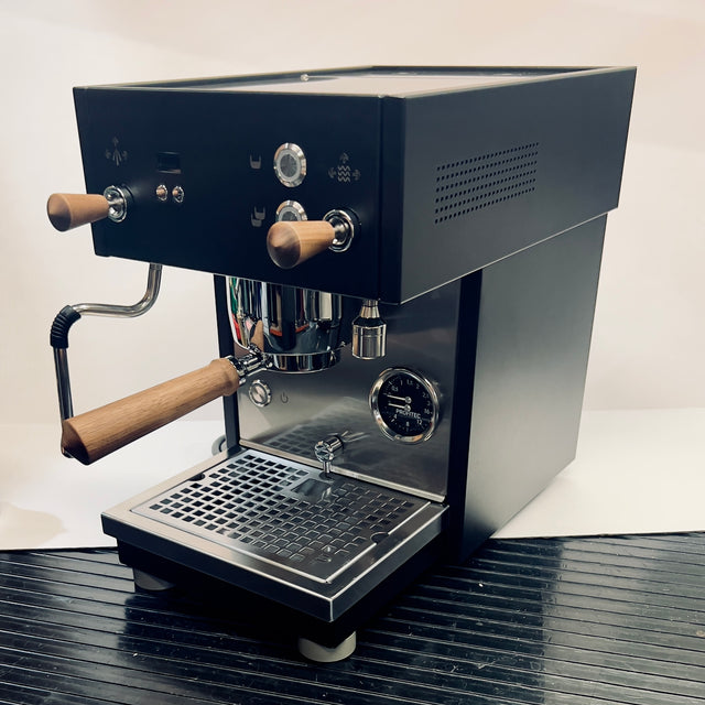 Open Box Profitec MOVE espresso machine with wooden portafilter handles and a front mounted gauge