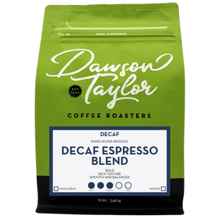 Green bag shows a blue framed label for Decaf Espresso Blend with Swiss Water Process