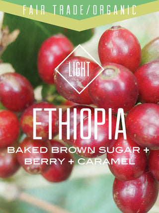 Organic Fair Trade Ethiopia Oromia Natural coffee label showing red coffee cherries and light roast notes baked brown sugar berry caramel