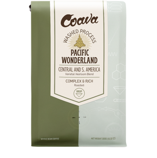 Pacific Wonderland coffee bag with green and light blue panels and a central white label.