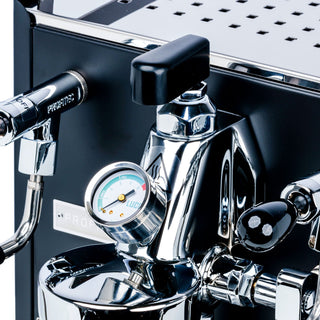 Close up of LUCCA stainless steel flow control with black mushroom knob and visible pressure gauge on espresso machine