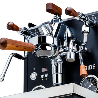 Front panel close-up of Profitec RIDE dual boiler with wooden levers and polished chrome hardware