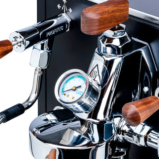 Close-up of Profitec RIDE espresso machine lever and pressure gauge with wooden handles and chrome finish