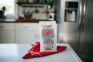 Organic Funky Chicken coffee bag on a kitchen counter with a bold rooster illustration