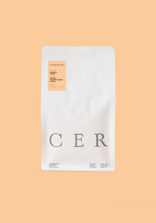White Rwanda Kanzu coffee bag with an orange Ceremony label on the front.