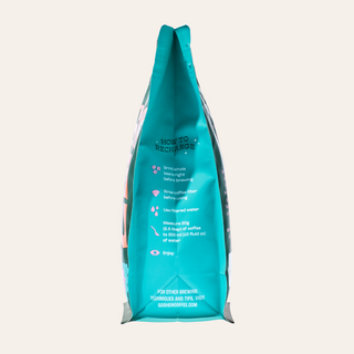 Teal Black Dog Espresso coffee bag standing upright with brewing tips printed on the front