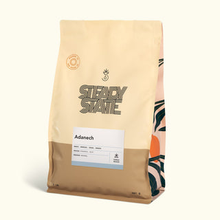 Adanech coffee bag with attached information card detailing origin Ethiopia Guji