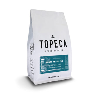 Santa Ana Blend coffee bag from Topeca Roasters with teal label and plant motif.