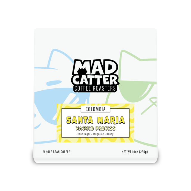 Colombia Santa Maria Huila washed coffee packaging with a yellow label and vibrant background artwork