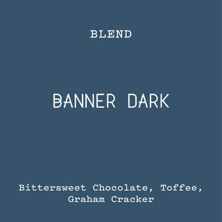 Banner Dark coffee blend cover on a blue background with bittersweet chocolate toffee and graham cracker notes.