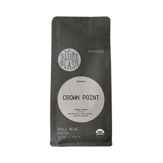 Sight Glass Crown Point espresso packaging a dark bag with a round beige label and organic seal