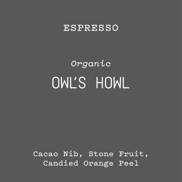 Owl's Howl espresso packaging on a dark gray background with Organic label and bold OWL'S HOWL text