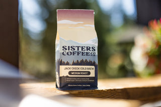 Jack Creek Cold Brew coffee bag from Sisters Coffee Co with mountain and forest artwork and a medium roast label