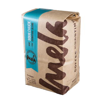 Squilchuck Blend bag with teal left label, branding for a smooth chocolate and stonefruit blend.