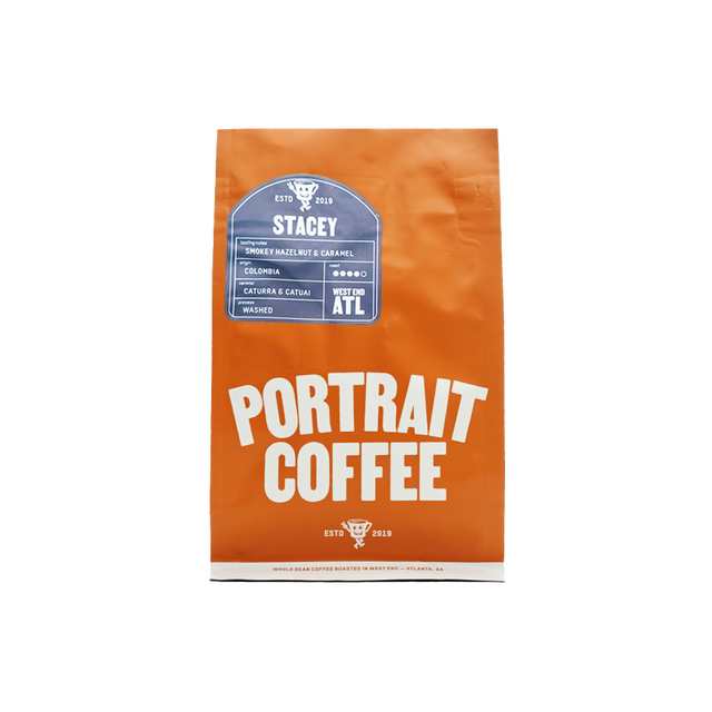 Orange STACEY coffee bag standing upright with a blue label and bold Portrait Coffee typography