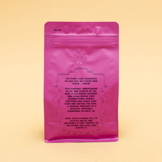 Back of a pink Stankonia coffee bag showing roast date label and printed notes