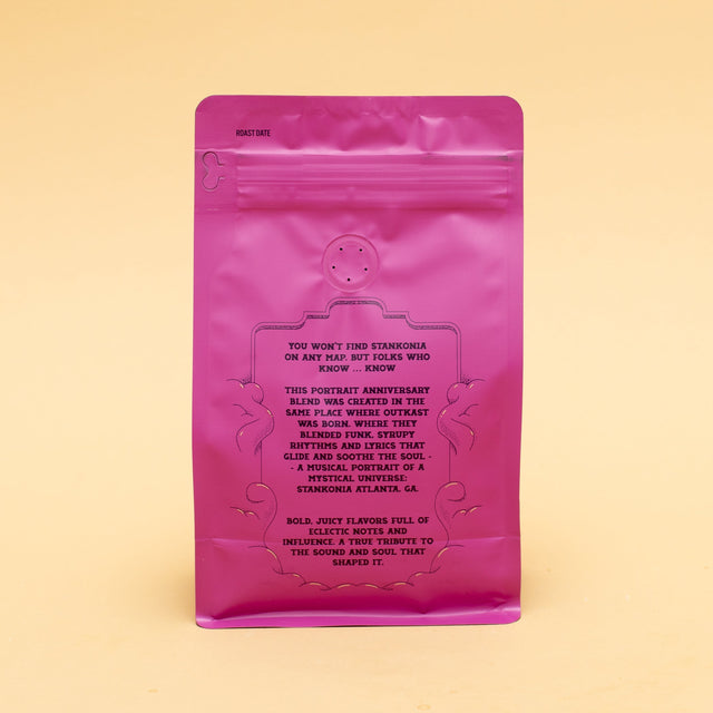Back of a pink Stankonia coffee bag showing roast date label and printed notes
