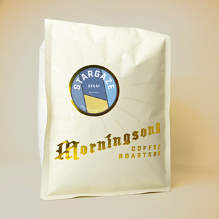 Stargaze Decaf coffee bag featuring a round blue label on a pale white package