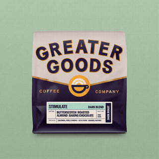 Greater Goods Stimulate Dark Blend coffee bag with bold label and notes of butterscotch and roasted almond