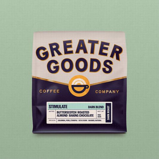 Greater Goods Stimulate Dark Blend coffee bag with bold label and notes of butterscotch and roasted almond