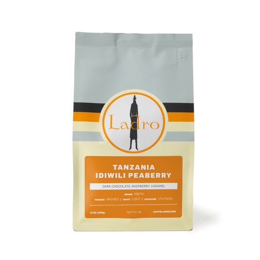 Front of a Tanzania Idiwili Peaberry coffee bag featuring the Ladro logo and orange label.