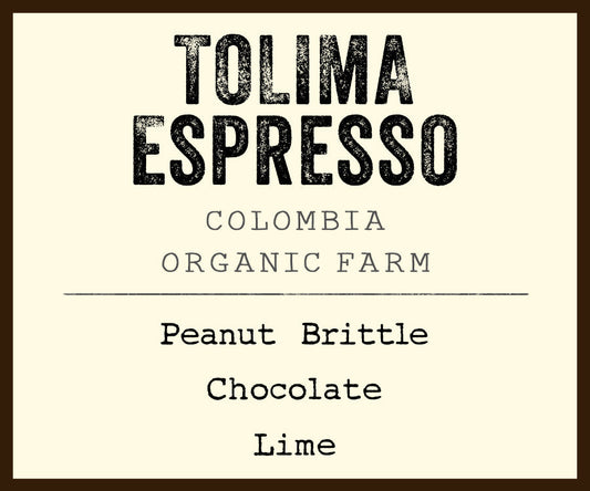 Tolima Espresso label showing Colombia organic farm branding and tasting notes peanut brittle chocolate lime