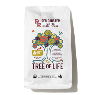 White Tree of Life coffee bag with a colorful swirling tree and Regenerative Organic Certified badge.