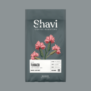 Burundi Turaco coffee bag with the Shavi Coffee Roasters logo and pink flower artwork.