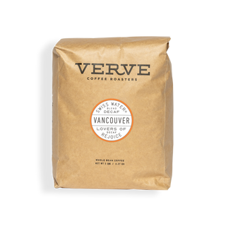 Brown paper bag of Vancouver Decaf coffee with Verve logo and circular Vancouver badge