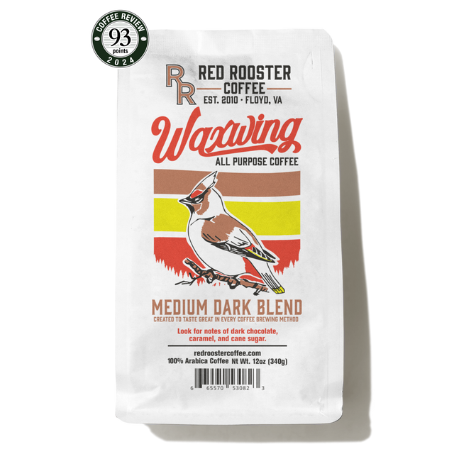 Waxwing All-Purpose Blend bag with bold label and a green coffee cup on a yellow saucer