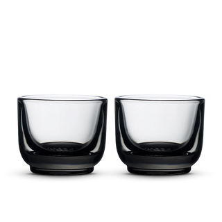 Pair of Fellow Pirch espresso shot glasses with pale green tinted bowls and dark bases
