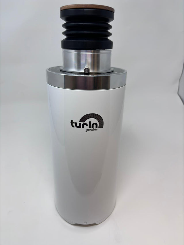 Front view of Turin DF64 Gen 2.5 grinder with white body chrome top ring and Turin logo.