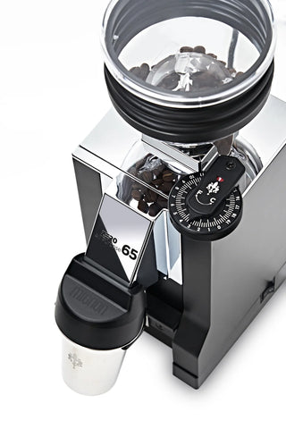 Top view of Eureka Mignon Zero 65 AP espresso grinder with transparent hopper and dosing cup.