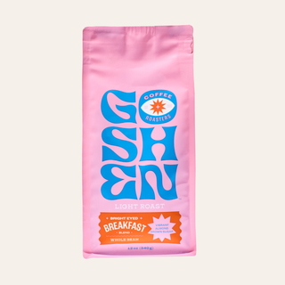 Pink Bright Eyed Breakfast coffee bag with blue decorative artwork and Goshen Roasters logo