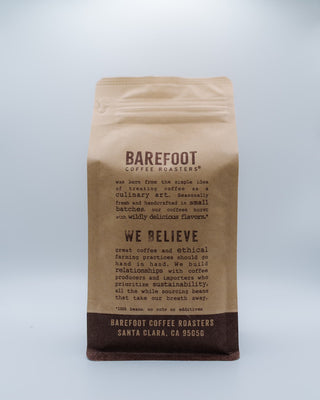 Barefoot Coffee Roasters bag with printed story text and Santa Clara address on brown kraft packaging
