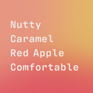 Close up of bell's flavor label on a peach gradient showing Nutty Caramel Red Apple Comfortable