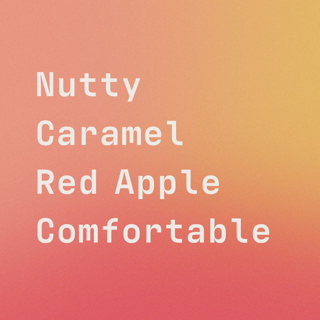 Close up of bell's flavor label on a peach gradient showing Nutty Caramel Red Apple Comfortable