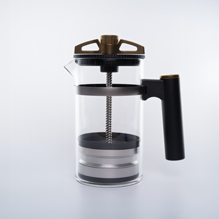 The BIRD top assembly with bronze crown and black ring atop a glass carafe