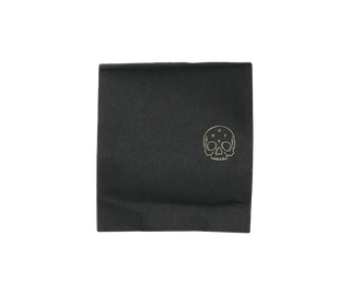 Onyx Eclipse dark roast coffee bag with a gold skull logo on black packaging