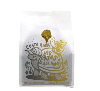 Costa Rica Las Lajas Black Honey coffee bag featuring a gold illustration on white packaging