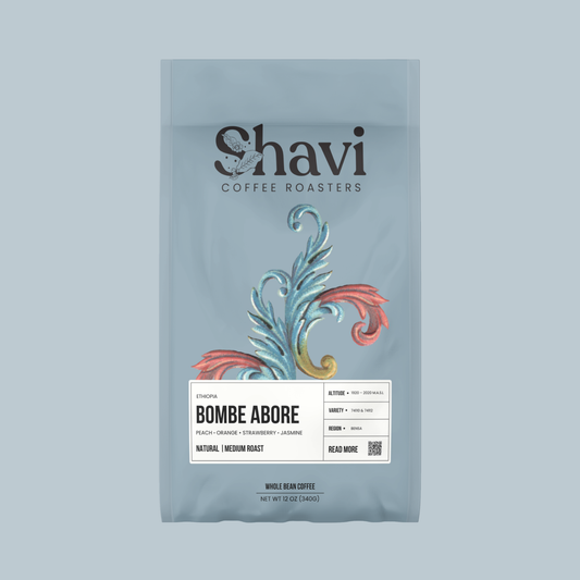 Bombe Abore coffee bag featuring the Shavi Coffee Roasters logo on a pale blue package