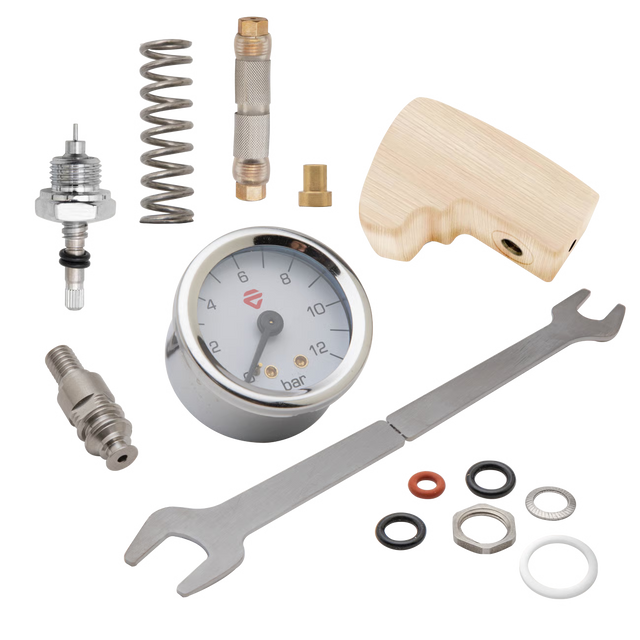 Lelit Mara X flow control kit components arranged on a gray background including gauge and wrench