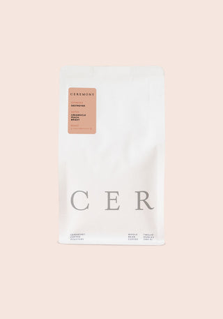 Destroyer coffee bag from Ceremony Coffee Roasters with peach label on a white pouch